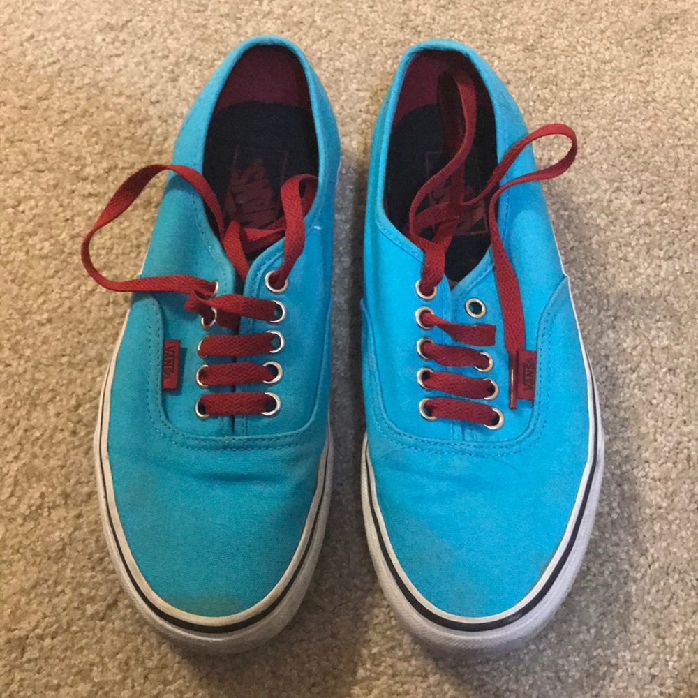 Blue vans sneakers with red laces
